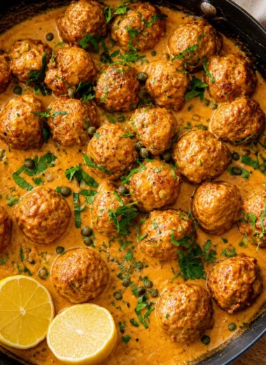 Classic German Königsberger Klopse meatballs in creamy caper sauce served with potatoes.